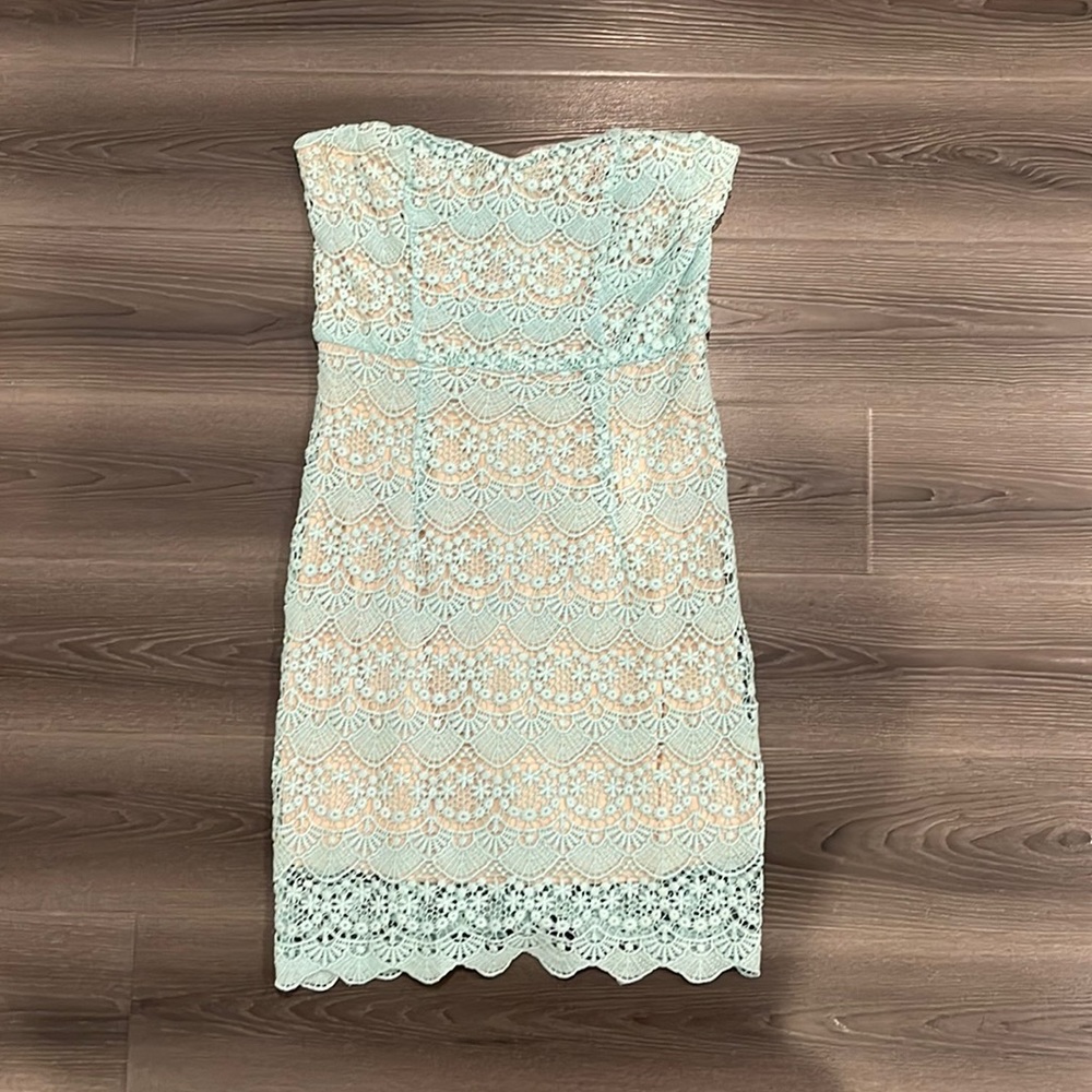 Baby blue crochet strapless mini dress.